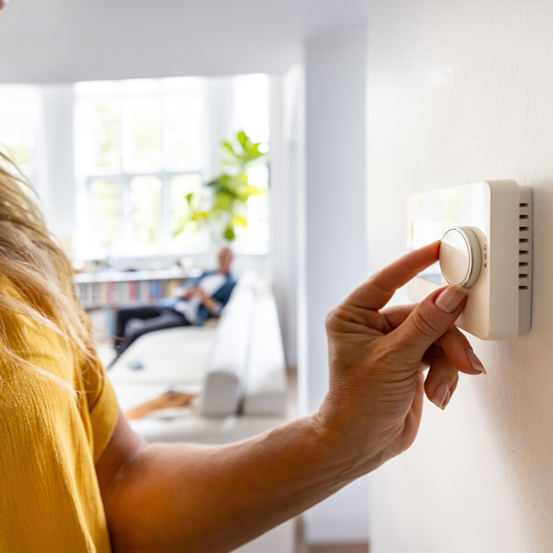 someone changing thermostat